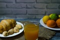 Still life with fresh fruits and glass of juice on the wooden background Royalty Free Stock Photo