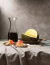 Still life with fresh melon, jamon and red wine on the table Royalty Free Stock Photo