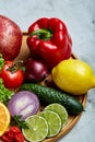 Still life of fresh organic vegetables on wooden plate over white background, selective focus, close-up Royalty Free Stock Photo