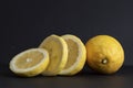 Still life with fresh Sorrento lemons and fresh lemon slices on a table