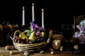 Still life fruit basket burning candles and glass of wine Royalty Free Stock Photo