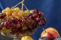 Still life with fruit and a bottle of wine. Apples, pears, plums, grapes and nectarines. Royalty Free Stock Photo