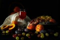 Still life with fruit and a glass of wine on a dark background Royalty Free Stock Photo