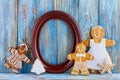 Still life of gingerbread, gingerbread men, brown frame on blue wooden background, template greeting card Royalty Free Stock Photo