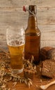 Still life from a glass and bottles with beer Royalty Free Stock Photo