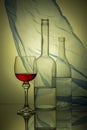 Still life with glass bottles and wine glass Royalty Free Stock Photo