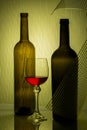 Still life with glass bottles and wine glass Royalty Free Stock Photo