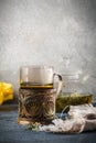 Still life with glass cup mug of tea in vintage retro stand and