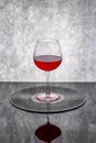 Still life with a glass of red wine on a vinyl record Royalty Free Stock Photo