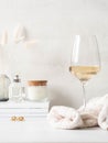 Still life of glass of white wine, sweater and various items Royalty Free Stock Photo