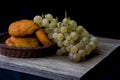 Still life with golden grapes and and paprika bread Royalty Free Stock Photo