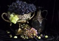 Still life with grape in vase and wine bottle Royalty Free Stock Photo