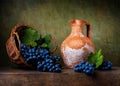 Still life with grapes on a basket Royalty Free Stock Photo