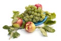 Still life grapes on a blue plate, apples and leaves Royalty Free Stock Photo