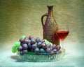 Still-life from grapes, bottle and glass of wine