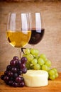 Still life with grapes, cheese and wine Royalty Free Stock Photo