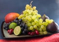 Exotic fruits variety still life with grapes, figs, lime, peach, mango and watermelon Royalty Free Stock Photo