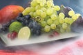 Exotic fruits variety still life with grapes, figs, lime, peach, mango and watermelon Royalty Free Stock Photo