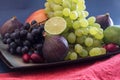 Exotic fruits variety still life with grapes, figs, lime, peach, mango and watermelon Royalty Free Stock Photo