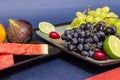 Exotic fruits variety still life with grapes, figs, lime, peach, mango and watermelon Royalty Free Stock Photo