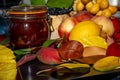 Still life with grapes, nectarines, lemon, jam and autumn leaves. Autumn harvest season. Fresh delicious healthy fruits Royalty Free Stock Photo