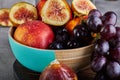 Still life of grapes, peaches, figs on a gray background