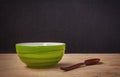 Still life green bowl with wooden shopsticks