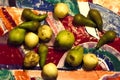 Still life with green yellow fruit. beautiful fresh fruits in the dark. mysterious green fruits on black background