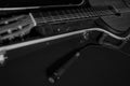 Still life with a guitar in a case and a dynamic microphone in black and white. Royalty Free Stock Photo