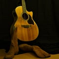 Still life of guitar and leather boots Royalty Free Stock Photo