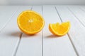 Still Life Half crescent, Half Fresh Orange Fruit on Vintage White Wood Table