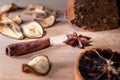 Still life with homemade cake, jar with honey and dipper, cinnamon, dried fruits, star anise on a wooden board. Small Royalty Free Stock Photo