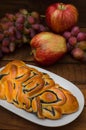 Still life of homemade pastries, sweet poppy pie on the background of fresh fruits, apples and grapes