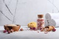 Still life with homemade roses bath salt, white towels and natural sea sponge Royalty Free Stock Photo