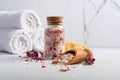 Still life with homemade roses bath salt, white towels and natural sea sponge Royalty Free Stock Photo