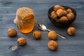 Still life of honey and nuts. Wood surface Royalty Free Stock Photo