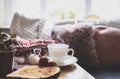 Still life Hot cuppa tea with steam with blurry foreground of toasted on a coffee table with morning light or Can be Cozy scene of Royalty Free Stock Photo
