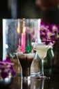 Still life with Iced coffee with cream, orchid flowers, burning Royalty Free Stock Photo