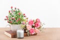 still life interior decoration pink rose flower in a vase with b Royalty Free Stock Photo