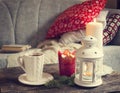 Still life interior details, cup of tea, candles near the sofa Royalty Free Stock Photo