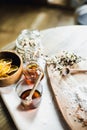 Still life, kitchen table, wooden board, vase, honey Royalty Free Stock Photo