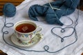 Still life with knitting and cup of tea on the old doyley Royalty Free Stock Photo