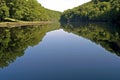 Still life of Lake Eguzon and forest, France Royalty Free Stock Photo