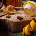 Still life with lemon and honey, on a wooden background in rustic style. The concept of spring avitaminosis and catarrhal diseases