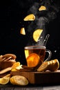 Still life with lemons flying into a mug of hot tea Royalty Free Stock Photo
