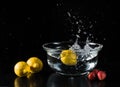 Still life with lemons and strawberries splashing water Royalty Free Stock Photo