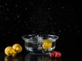 Still life with lemons and strawberries splashing water Royalty Free Stock Photo