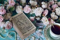 Still life with Lenormand oracle cards, cup and roses Royalty Free Stock Photo