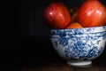 Still life light painting photography of red apples in stacked Blue and White bowls Royalty Free Stock Photo