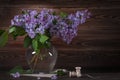 A large bouquet of lilacs on the table. Still life. Royalty Free Stock Photo